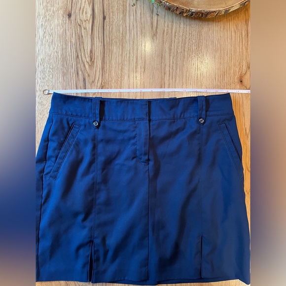 Izod Womens Skort Navy Blue Pockets Golf  Solid Zip Button Front Pleated Hem - Picture 8 of 9
